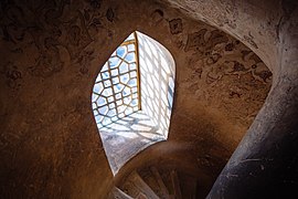 Wooden windows on one of the spiral staircases of Aali Qapo Palace