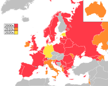 Map of countries in Europe, North Africa and Western Asia, with Australia as an insert in the top-right corner, coloured to indicate the decade in which they first participated in the contest: 2000s in red, 2010s in orange, 2020s in yellow