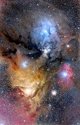 Rho Ophiuchi Region, with the main dark nebula Lynds 1688 (and further L1689) to the left, ρ Ophiuchi at the center of the large blue area (IC 4604), Antares in the large yellow area and Sigma Scorpii in the redish Sh2-9 area, with Messier 4 inbetween the latter two stars. North is up. July 2, 2019 photo by Adam Block.