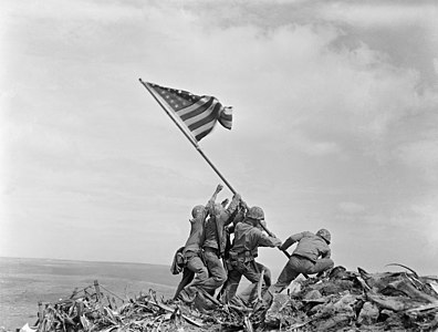 United States Marines raising the American flag on Mount Suribachi, Iwo Jima, February 1945.