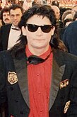 Actor Corey Feldman wearing Wayfarers at the Academy Awards, 1989