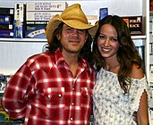 Acker with Christian Kane at a signing in Santa Barbara (21 August 2004)