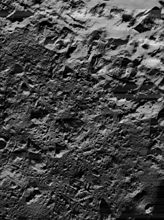 Lunar Orbiter 5 image of the northeastern crater floor, showing irregular surface of cracked impact melt. Illumination is from lower right.