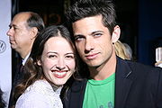 Acker with James Carpinello at the premiere of Serenity (22 September 2005)