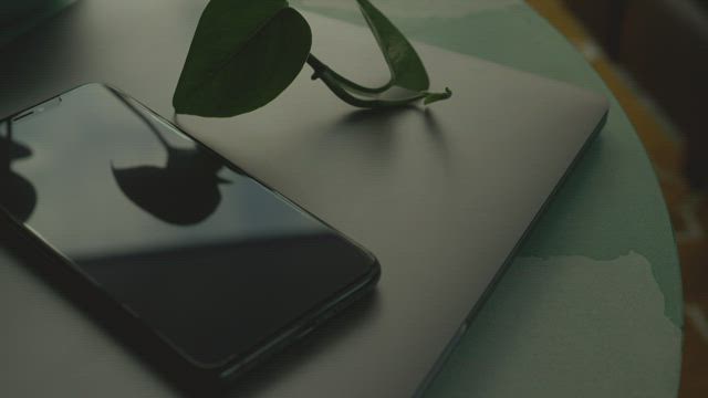 Black phone on laptop.