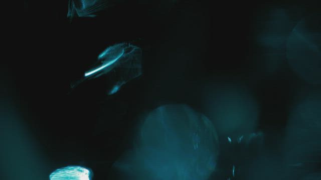 Blue crystal-like light leak overlay .